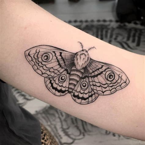 black and grey moth tattoo